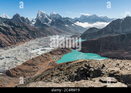 Emerald lakes, snow-capped himalayan peaks and the massive Ngozumpa glacier make the view from Gokyo Ri in Nepal one of the best in the world. Stock Photo