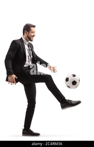 Businessman playing soccer ball isolated in white Stock Photo - Alamy