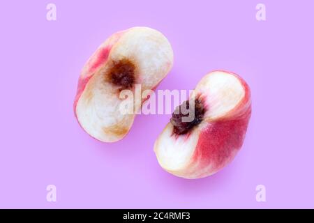 Chinese flat peaches on pink background. Top view Stock Photo