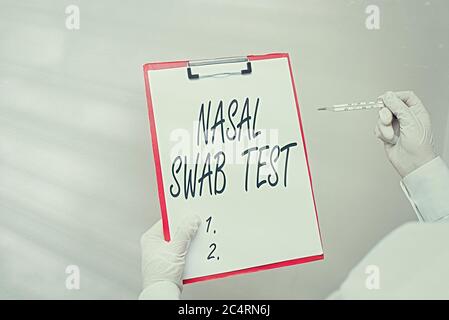 Writing note showing Nasal Swab Test. Business concept for diagnosing an upper respiratory tract infection through nasal secretion Laboratory blood te Stock Photo