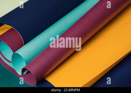 Scrolls of colorful paper in pastel colors. Creative multitask background for various design tasks. Copy space. Selective focus. Stock Photo