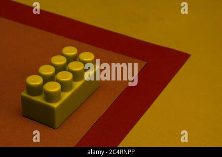 Creative background with detail of a child s designer. A fragment of a designer for children on a multi-colored surface. Close-up. Copy space. Selecti Stock Photo