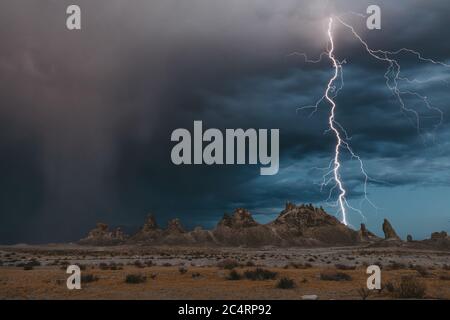 Lightning strikes the tufa formations at Trona Pinnacles, California Stock Photo
