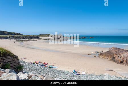 Bathers at Corblets Bay on Alderney, third-biggest of the British Channel Islands. Stock Photo