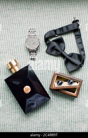 Groom accessories. Bow tie, perfume, cufflinks, wrist watch. Preparati Stock Photo