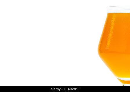 Cold beer in a Teku tasting glass filled to full with foam, drops of water on glass, half glass visible on the right, isolated on a white background w Stock Photo
