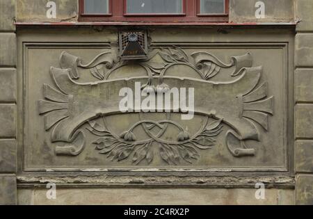Gas vent cover placed on the Art Nouveau stucco decoration dated from 1905 on the revenue house in Černomořská Street in Vršovice district in Prague, Czech Republic. Stock Photo