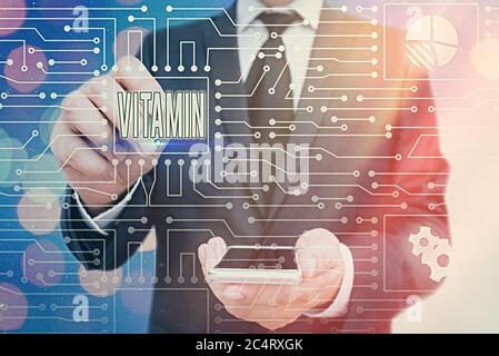 Handwriting text Vitamin. Conceptual photo organic molecule that is essential micronutrient that organism needs System administrator control, gear con Stock Photo