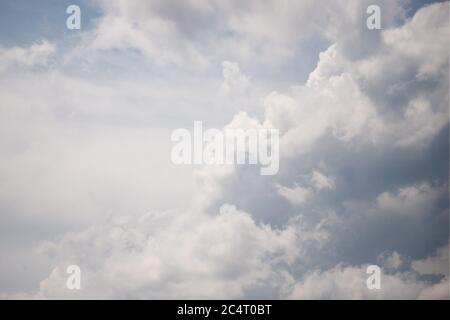 Gray and white fluffy clouds in the pale sky. Beautiful sky Stock Photo