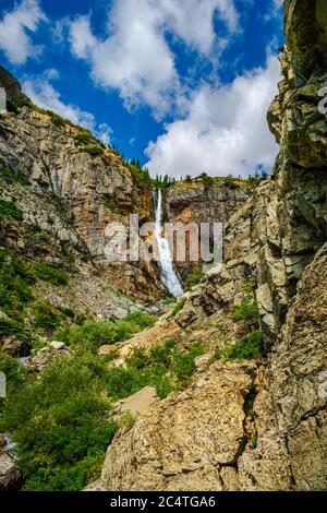 5074 Approaching Apikuni Falls at Glacier National Park Montana among the rugged path Stock Photo