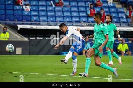 Barcelona, Spain. 28th June, 2020. RCD Espanyol's Wu Lei (L) shoots during a Spanish league football match between RCD Espanyol and Real Madrid in Barcelona, Spain, June 28, 2020. Credit: Joan Gosa/Xinhua/Alamy Live News Stock Photo