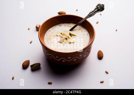 Daliya kheer or Dalia Payasam – Broken or Cracked wheat and milk porridge with sugar cooked in Indian way. Dalia is a popular breakfast cereal in Nort Stock Photo