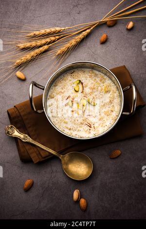 Daliya kheer or Dalia Payasam – Broken or Cracked wheat and milk porridge with sugar cooked in Indian way. Dalia is a popular breakfast cereal in Nort Stock Photo