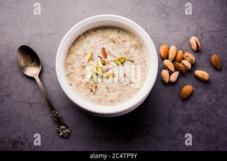 Daliya kheer or Dalia Payasam – Broken or Cracked wheat and milk porridge with sugar cooked in Indian way. Dalia is a popular breakfast cereal in Nort Stock Photo