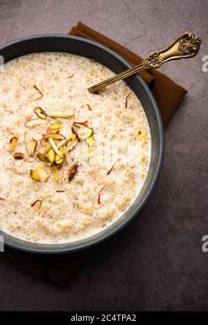 Daliya kheer or Dalia Payasam – Broken or Cracked wheat and milk porridge with sugar cooked in Indian way. Dalia is a popular breakfast cereal in Nort Stock Photo