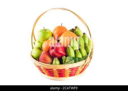 fresh orange, Chinese pear, banana, green apple and red apple in bamboo wicker basket on white background fruit health food isolated Stock Photo