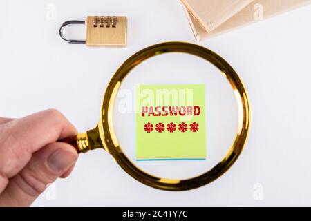 PASSWORD. Data security, identity and social media concept. Man's hand, holding magnifying glass. Stock Photo