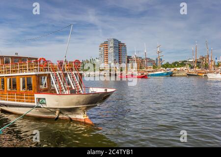 Old ships at the quay in the harbor of Kiel, Germany Stock Photo