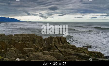 Looking south at The Pancake Rocks at Dolomite Point, geological formation and tourist destination at Punakaiki, Greymouth, New Zealand. Stock Photo