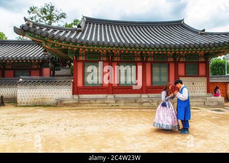 Seoul, South Korea, October 3th, 2017: A South Korean family visiting historical Changdeokgung Site in Seoul, with traditional Hanbok clothes. Stock Photo