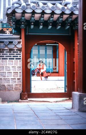 Seoul, South Korea, October 3th, 2017: A South Korean family visiting historical Changdeokgung Site in Seoul, with traditional Hanbok clothes. Stock Photo