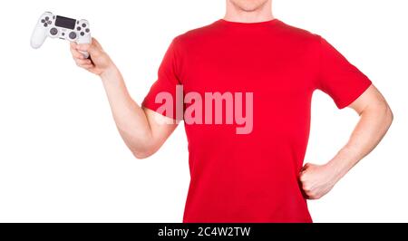 Man in red t-shirt holding video game joysticks gamepad on his palm isolated Stock Photo