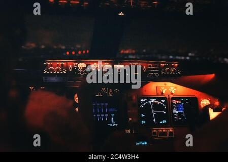 Jet cockpit and runway lights during a night landing. Stock Photo