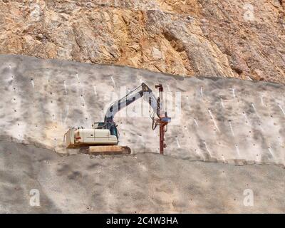 Drilling rig on the quarry sledge. Blasthole drilling operations. Stock Photo