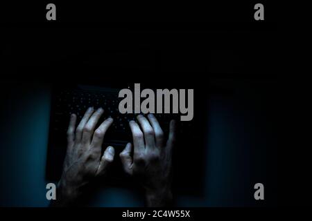 Top view of the hands of a programmer on  his laptop. Stock Photo