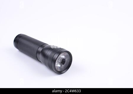 Black flashlight isolated on a white background Stock Photo