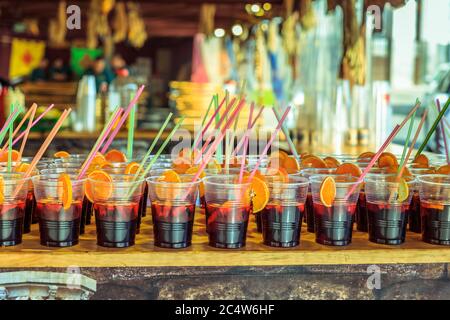 Plastic cups with refreshing drinks with alcohol in the bar of a summer  festival in Spain Stock Photo - Alamy