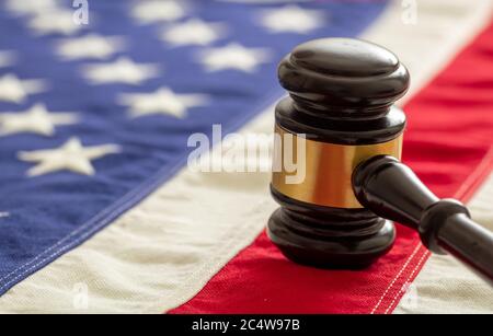 Judge or auction gavel on United states of America flag background. Justice and law in USA concept Stock Photo