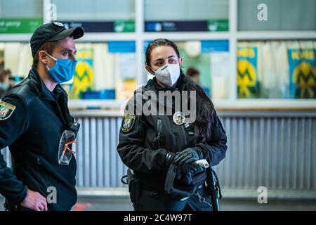 UKRAINE, KIEV - MAY 26, 2020: subway station Zoloty Vorota (Golden Gate). Security people checks the flow of passengers in the metro station Stock Photo