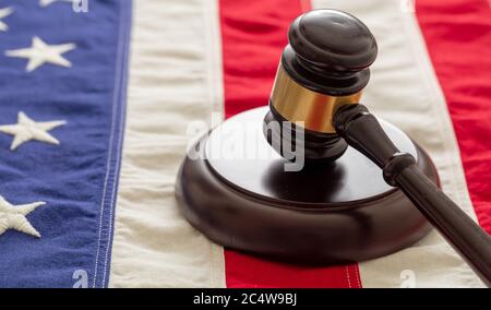 Judge or auction gavel on United states of America flag background. Justice and law in USA concept Stock Photo
