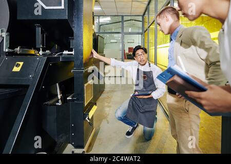 Coffee roastery owner discussing coffee beans distribution with business partners Stock Photo