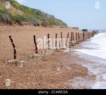 Broken sea defences and old wartime bunker at Happisburgh, Norfolk ...