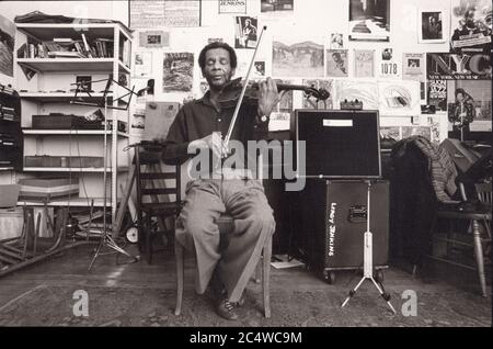 Posed portrait of jazz violinist composer  Leroy Jenkins in his Manhattan studio & workplace. New York City, 1983. Stock Photo