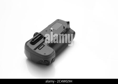 Battery Grip for Nikon DSLR Cameras isolated on white background. Stock Photo