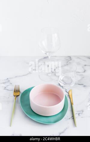 Stylish elegant table setting with ceramic plates on white marble background Stock Photo