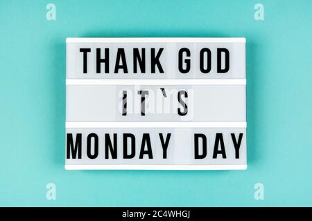 Text THANKS GOD IT IS MONDAY DAY on lightbox on blue background Stock Photo