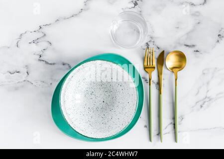 Stylish elegant table setting with ceramic plates on white marble background, top view Stock Photo