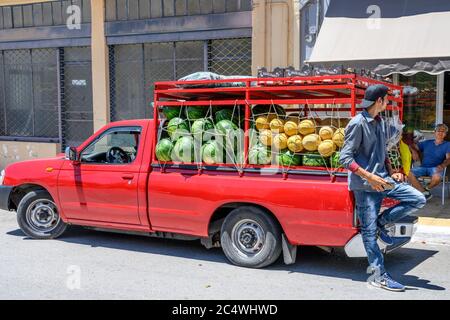 Selling melons from a pickup truck at the Sunday market in the small town of Kopanaki, northwestern Messinia, Peloponnese, Greece. Stock Photo