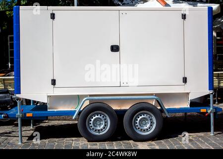 Mobile electric power generator for emergency situations, outdoor on wheel. Stock Photo