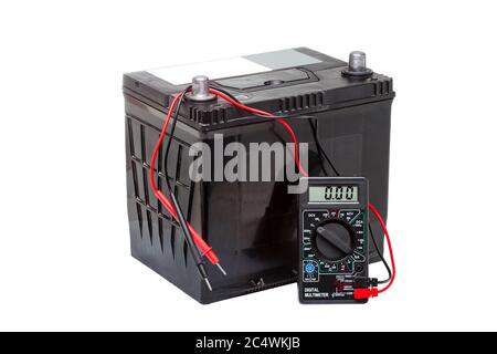 Car battery with digital multimeter isolated on white background. Stock Photo