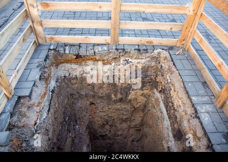 The hole road repair and caution barrier above sinkhole. Stock Photo