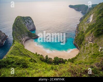 Beautiful viewpoint of Kelingking beach in Nusa Penida island, Bali, Indonesia. Drone view. Stock Photo