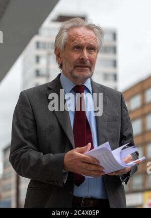 The mayor of Leicester Sir Peter Soulsby with a report from Public Health England as the city may be the first UK location to be subjected to a local lockdown after a spike in coronavirus cases. Stock Photo