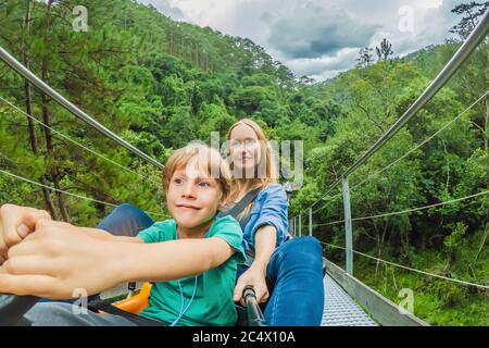 Mother and son on the alpine coaster Stock Photo