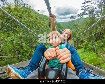 Mother and son on the alpine coaster Stock Photo