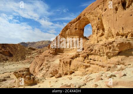 Natural rock arch in the Timna park, Negev desert, Israel Stock Photo